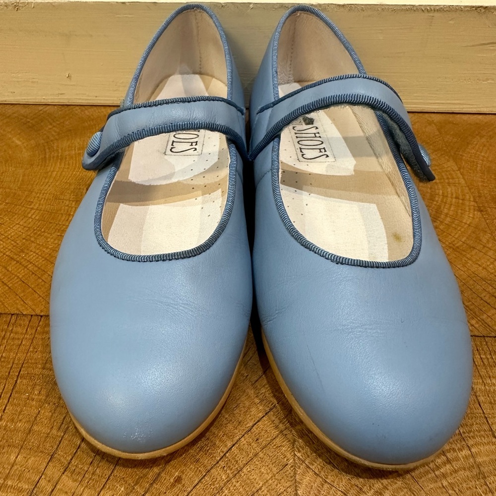 Blue girls Mary Jane shoes with Velcro strap.
